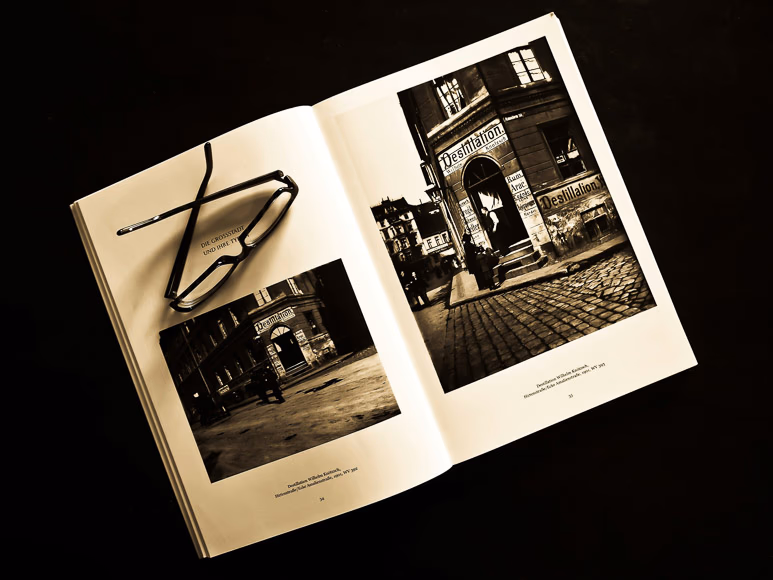 A person holding a finished photo book showing family memories
