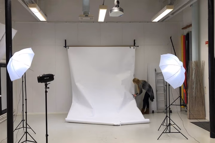 A professional studio setup with clean neutral wall color