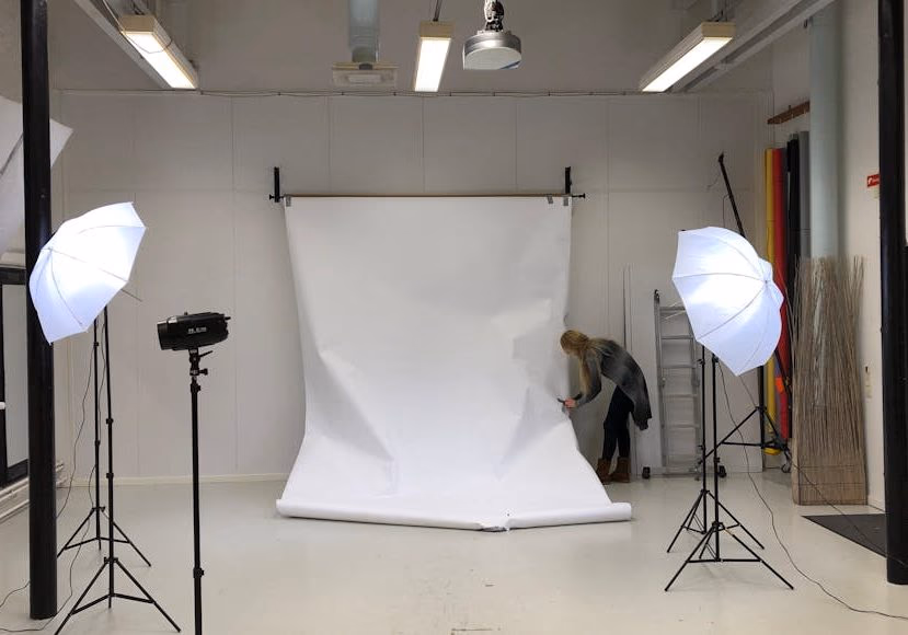 A professional studio setup with clean neutral wall color